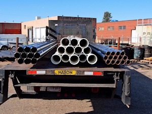 Great Western Pipe delivery truck carrying carbon steel pipe.